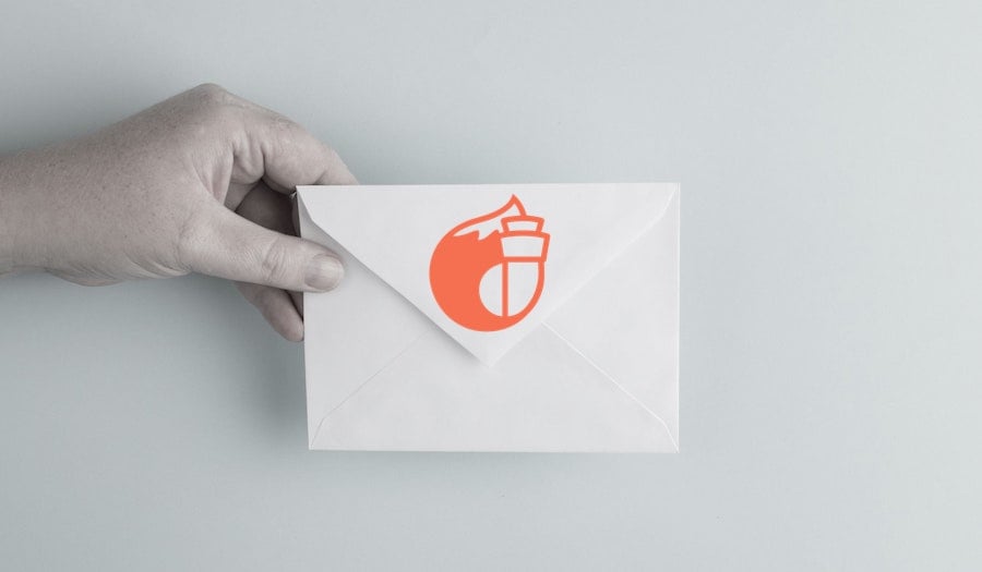 Person holding envelope (FoxATM newsletter blog)