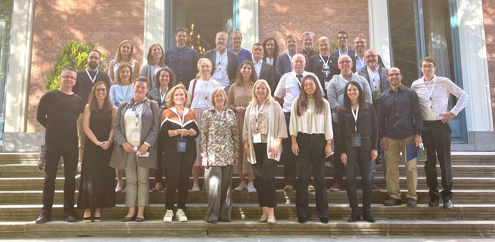The European CISM conference attendants stood on the steps outside the venue. The attendants include Julija Razmislavičienė who represented FoxATM at the event.