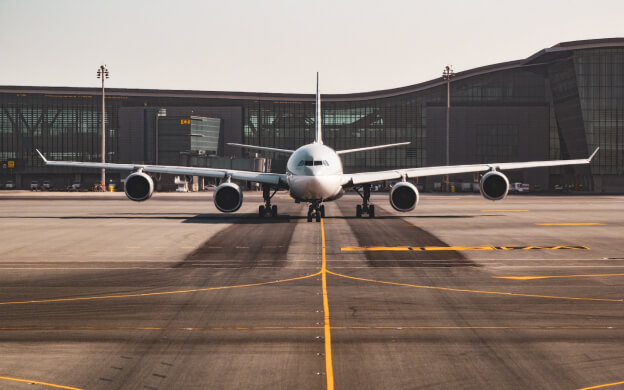 Front facing view of an airplane at an airport