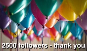 A room full of multicoloured balloons - the text underneath reads: 